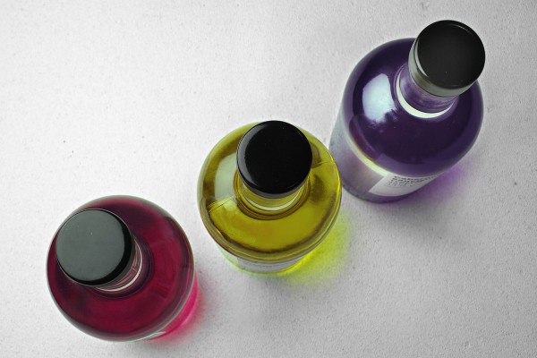 Bottles dipped in Paint for the Edelbrand Series Packaging