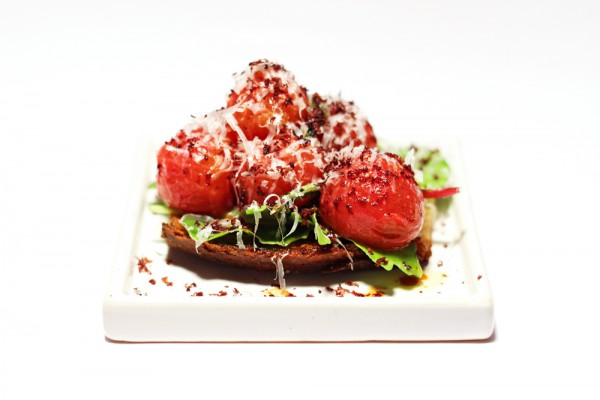 Tomato Bruschetta with dried olives and Parmesan cheese