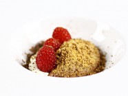 Chocolate mousse with white chocolate crumble and raspberries