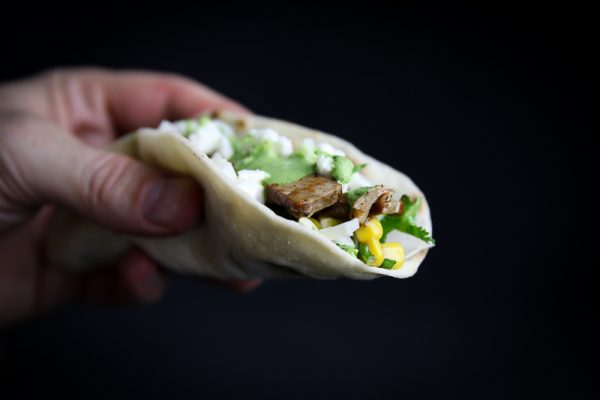 Pork Collar Taco with Chipotle Corn Salsa, Cilantro Sauce and Feta Cheese